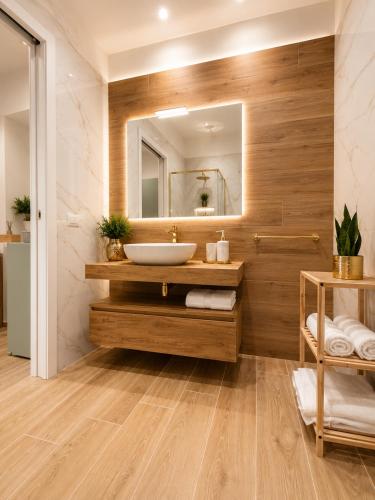 a bathroom with a sink and a mirror at Sicily Luxury Apartments in Palermo