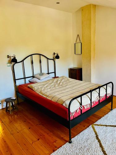 a bedroom with a bed in a room at Maison Aubergerac in Bergerac
