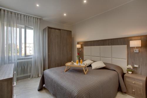 A bed or beds in a room at Versilia Residence