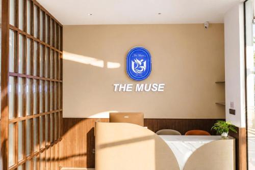 an office with a logo on the wall at The Muse Hotel 2 in Ðố Sơn