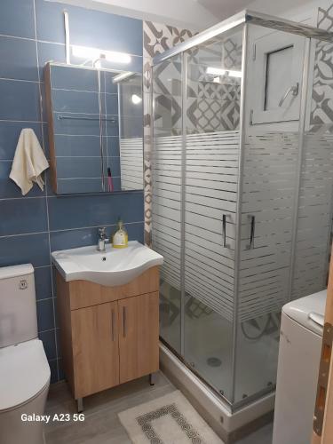 a bathroom with a shower and a sink at Menidi Sea View 302 in Menídion