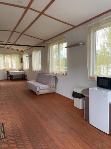 a living room with a couch and a table at Valterkrasti in Ogureckaja