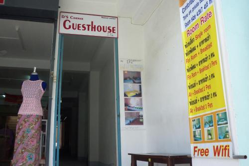 a dress on a hanger in a store with a sign at D's Corner & Guesthouse in Phuket