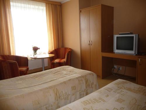 Кровать или кровати в номере Motel Tėvynė