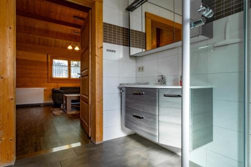 a kitchen with a sink and a counter at Waldsiedlung - Haus 13 in Großkoschen