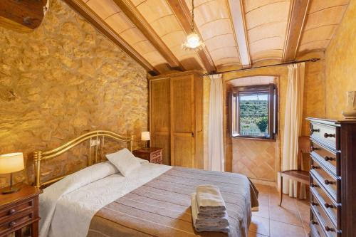 a bedroom with a bed in a room at Casa Rural Ca La Siona in Avinyonet