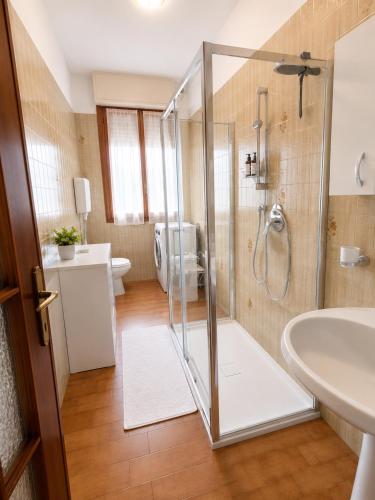 a bathroom with a shower and a sink and a toilet at Casa Eliana - Camporosso in Camporosso