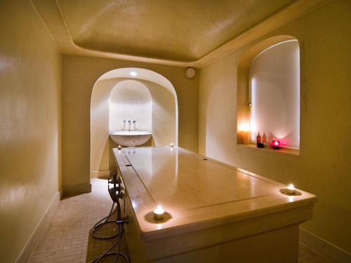 a bathroom with a sink and a mirror at Sofitel Legend The Grand Amsterdam in Amsterdam