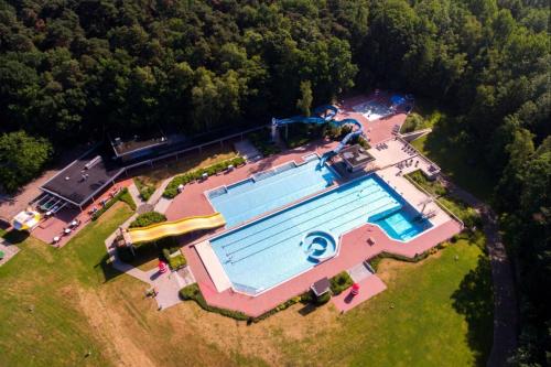 an overhead view of a swimming pool on a estate at Ferienpark Grafschaft Bentheim in Uelsen