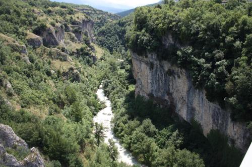 a view of a river in a canyon with trees at Agriturismo "Borgo Madonna degli Angeli" - charming cottages in the gardens ! in Tocco da Casauria