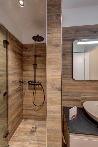 a bathroom with a shower and a sink at La VILLA DELLE TORRI in Ermoupoli