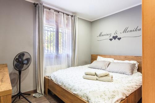 a bedroom with a bed with two towels on it at Villa Toro in Maçanet de la Selva