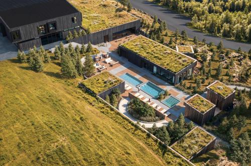 an aerial view of a building with a swimming pool at 360 Hotel Boutique and Spa in Selfoss