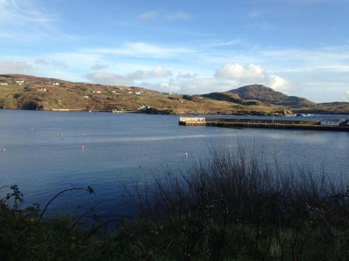 a large body of water with mountains in the background at Slieve League House B&B in Teelin