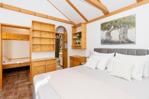 a bedroom with a bed and a bathroom at Ranch Frida in Vodice