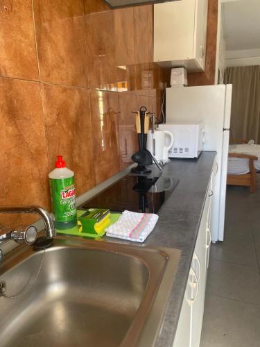 a kitchen with a sink and a counter top at BERMUDAS-TURIS Apartamentos in Benidorm