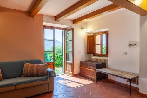a living room with a couch and a table at Podere Par di Rota in Calci