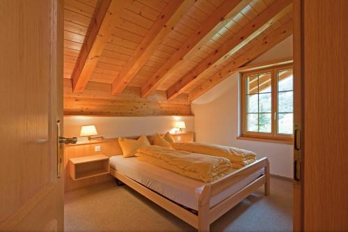 Tempat tidur dalam kamar di Les Naturelles