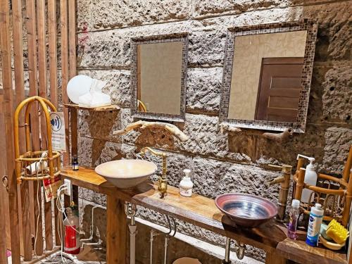 a bathroom with a sink and two mirrors at Nikko Park Lodge Tobu Station in Nikko