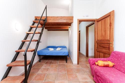 a room with a bunk bed and a ladder at Sole in Onifai