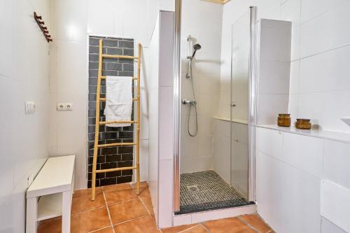 a shower with a glass door in a bathroom at Villa Javier in Torrox