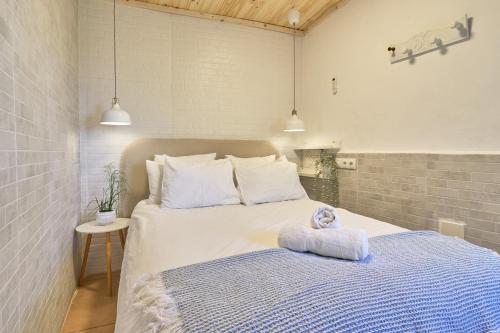 a bedroom with a bed with a stuffed animal on it at Villa Javier in Torrox