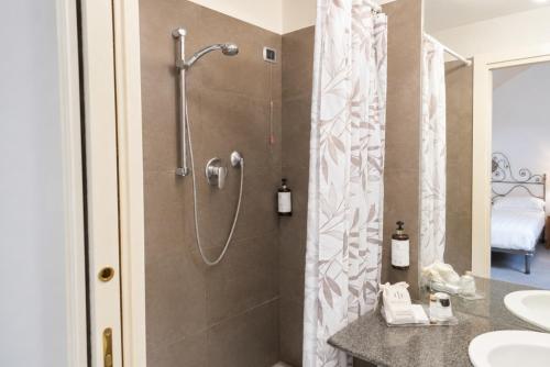 a bathroom with a shower and a sink at Phi Hotel Palio in Asti