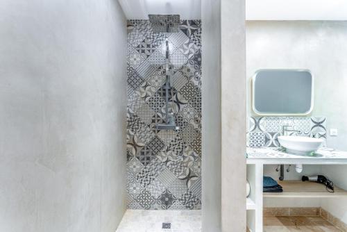 a bathroom with a sink and a mirror at Mas Delorme 1 in Arles