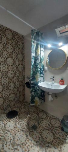 a bathroom with a sink and a mirror at MUSHROOMs1 AFYTOS in Afitos