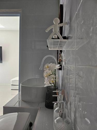 a bathroom with a bath tub and a sink at Treat Boutique HuaHin 94 in Hua Hin