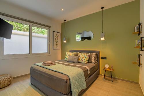 a bedroom with a bed and a window at Kalafatis Garden House in Itea