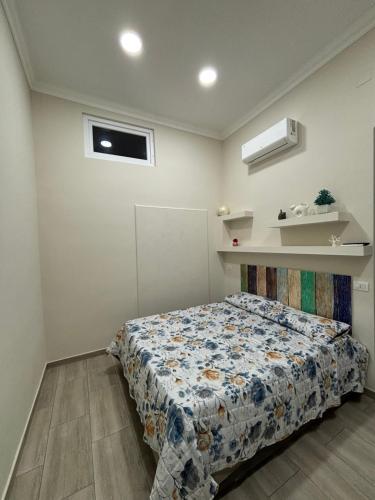 a bedroom with a bed in a room at MareLuna in Torre del Greco