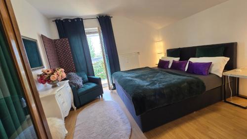 a bedroom with a large bed with purple pillows at Radolfzell Bodensee in Radolfzell am Bodensee