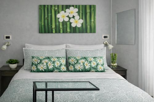 a bedroom with a bed with a glass table on it at B&B Residence Armonia Sulmona in Sulmona