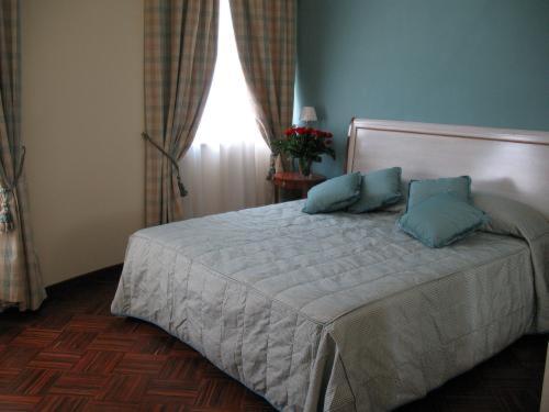 
A bed or beds in a room at Hotel San Giorgio
