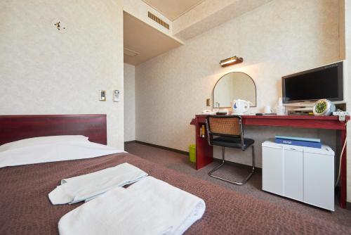 Posteľ alebo postele v izbe v ubytovaní Select Inn Yonezawa