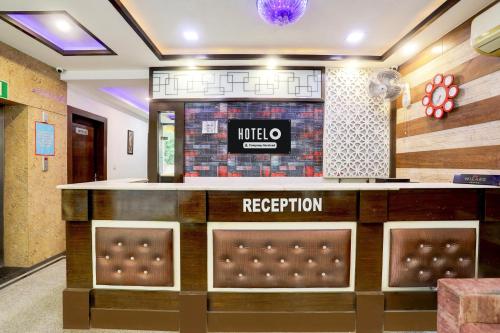 a lobby of a hotel with a reception counter at Hotel O Taj Nagri Near Taj Mahal East Gate Formerly Riviera in Agra