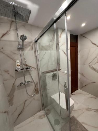 a bathroom with a shower and a toilet at Beautiful Duplex in Callao Salvaje in Callao Salvaje