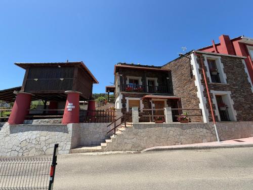 a building with a staircase in front of it at Casa do Lagar, Praia da Abrela in O Vicedo
