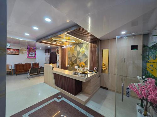 a lobby with a reception counter in a building at DD COZY INN sntower in Tiruchirappalli