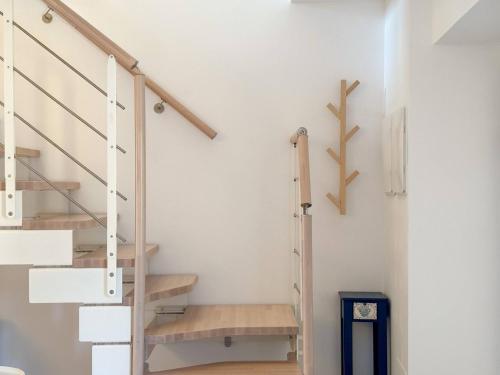a staircase in a room with white walls at Dimora Fonte Grande in Lanciano