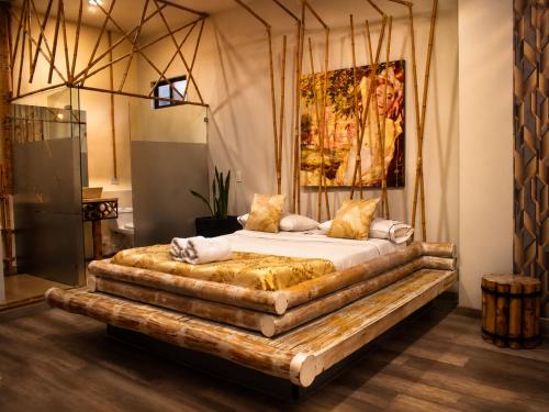 a bedroom with a bed made out of a log at Zen Hotel Boutique in Bogotá
