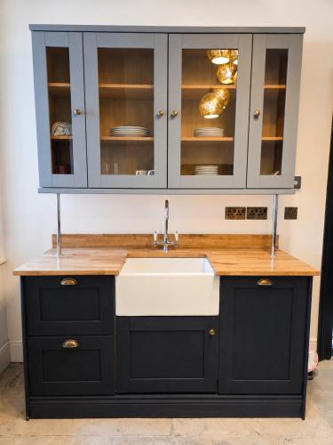 a kitchen with a sink and a cabinet at NO 60 Sligo in Sligo