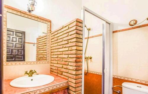 a bathroom with a sink and a mirror at Casa La Seguiriya in Las Lagunillas