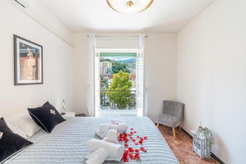 a bedroom with a bed with stuffed animals on it at Casa Iris h Sanremo in Sanremo
