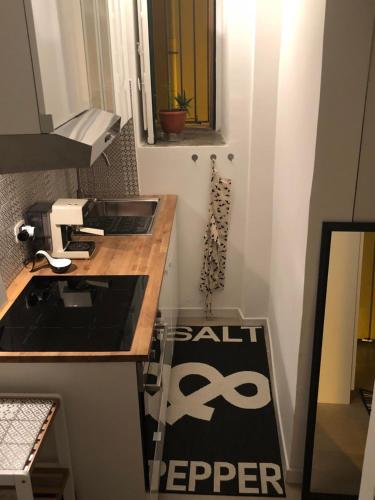 a small kitchen with a counter with a sink at Casa Marina in Scilla