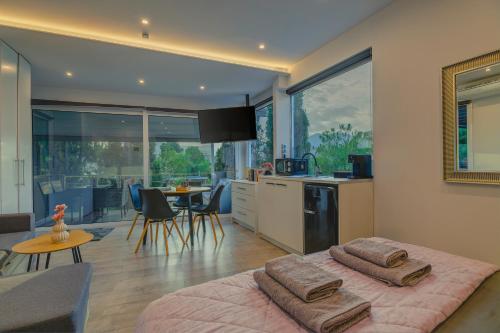 a bedroom with a bed with two towels on it at Kalafatis beach home in Itea