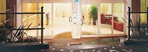 an open door to a room with potted plants at Residence Queen Mary in Cattolica