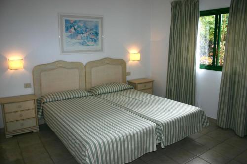 Un pat sau paturi într-o cameră la La Villa