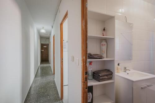 a small bathroom with a sink and a mirror at Pisito de Pueblo I I in Navaluenga